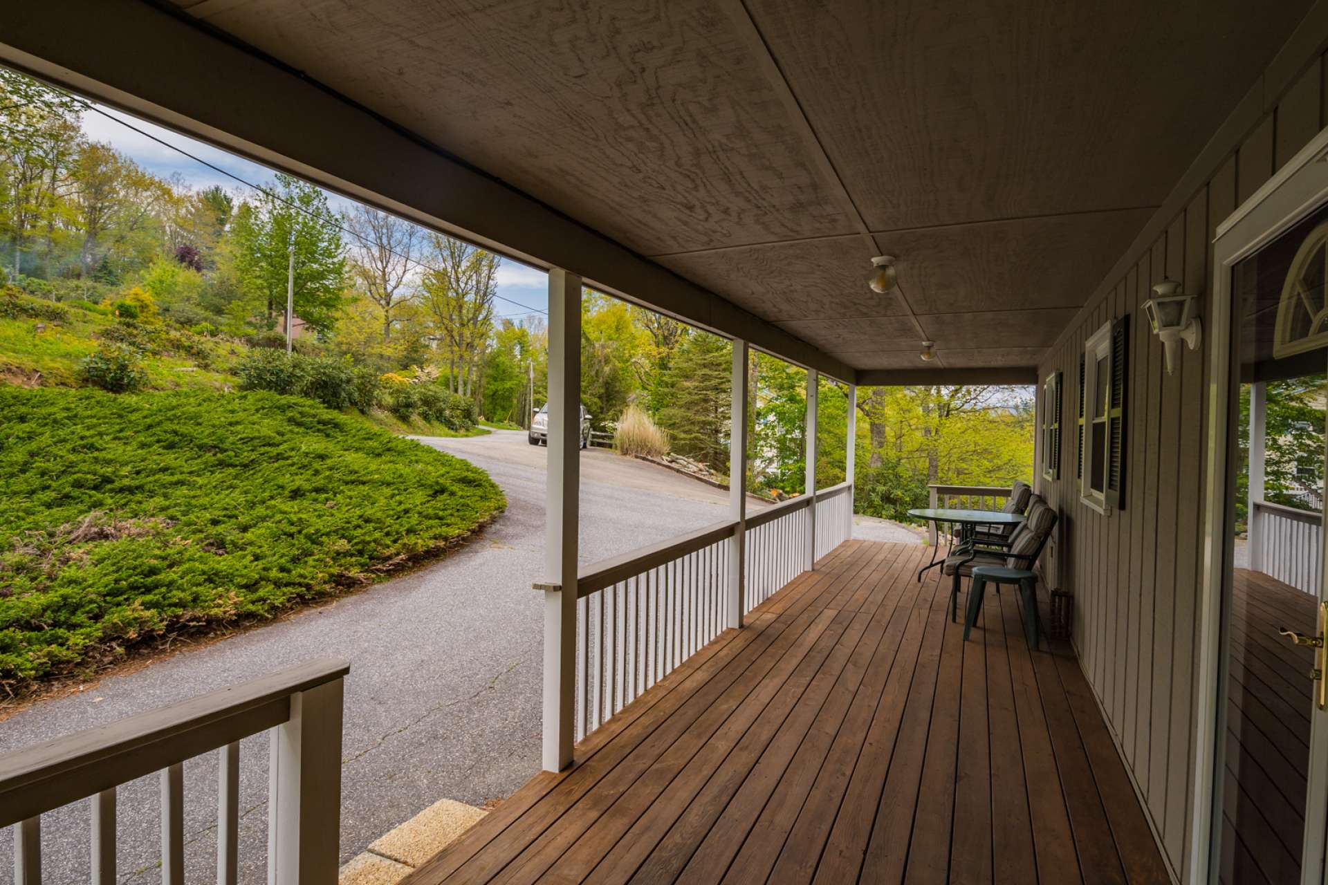A full length covered front porch welcomes all  who enter and beckons you to savor the beauty and sounds of the mountains.