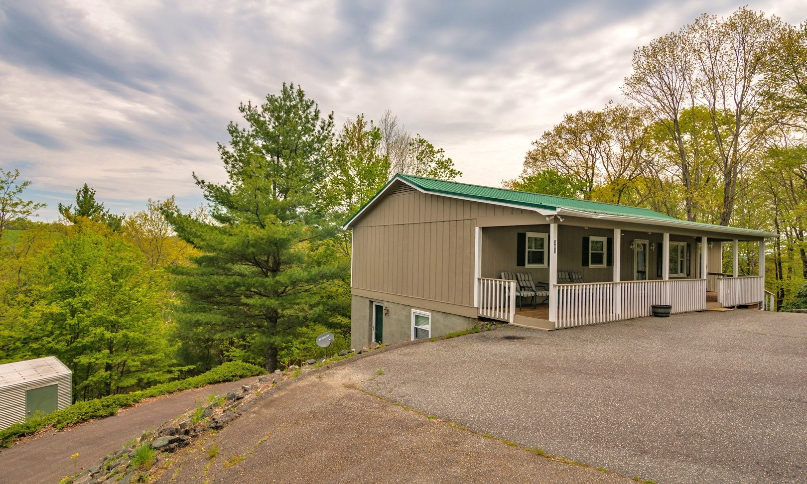Located just minutes to Downtown West Jefferson, this 3-bedroom, 2-bath NC Mountain ranch style home overs easy one level living on a peaceful 1.4 acre setting with mountain views.