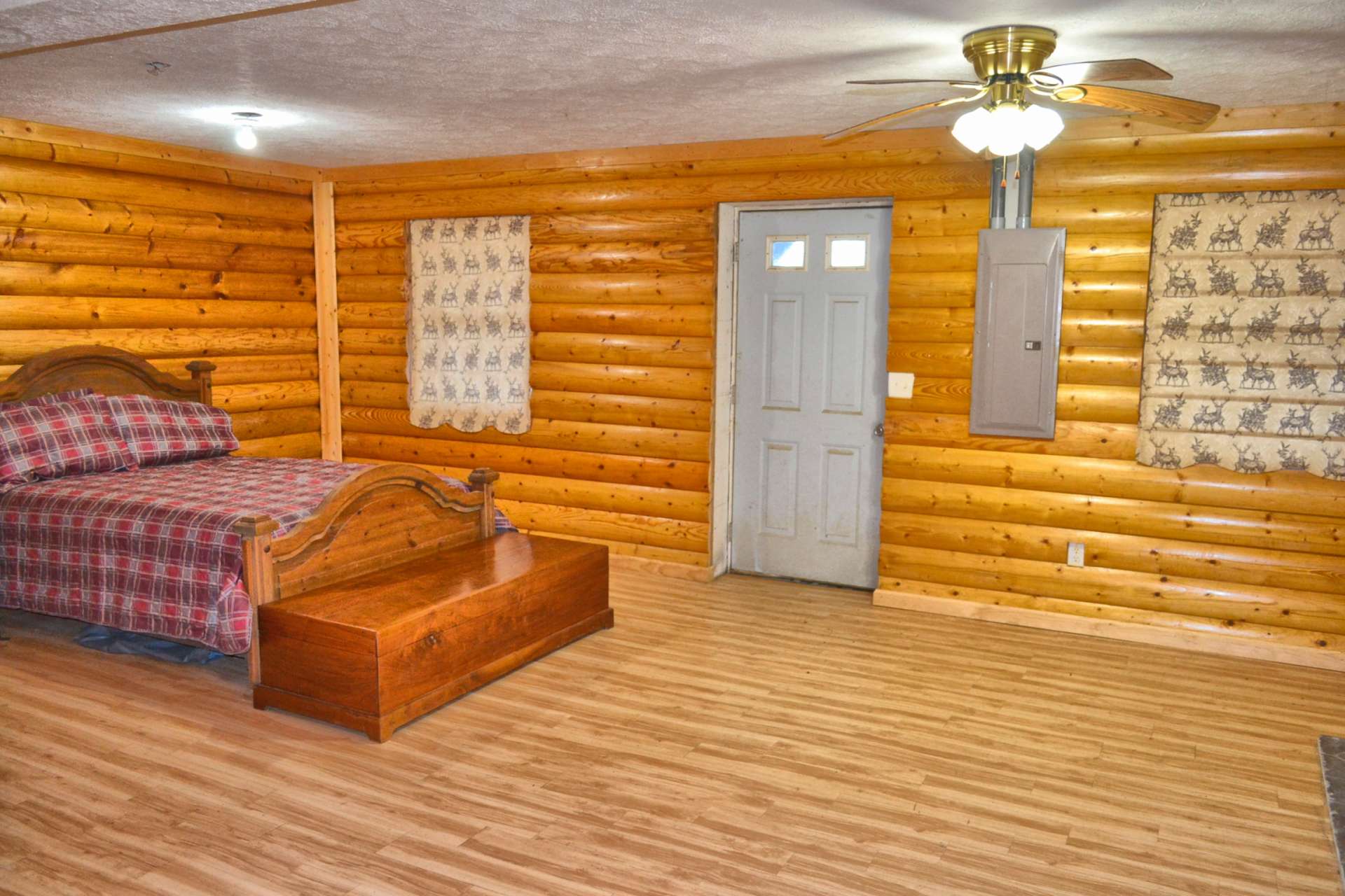 This level features a full bath with laundry area and access to the lower patio.