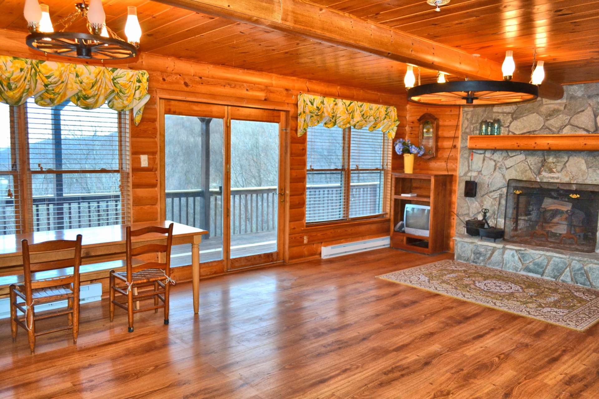 The main level offers an open great room with lots of glass allowing natural light to fill the cabin.