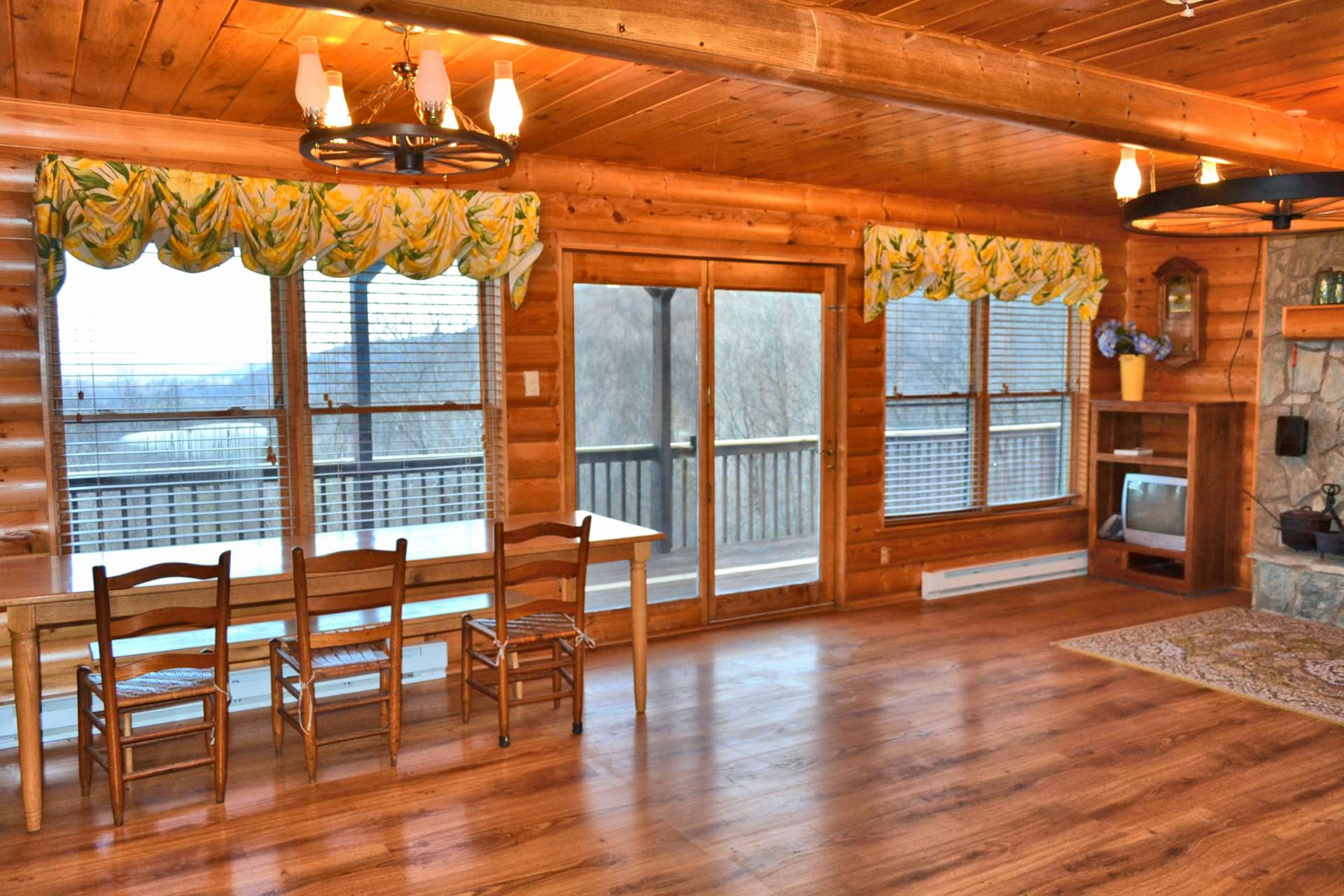 Enjoy the views through all four seasons in the great room. Notice the dining area has direct views when dining inside.