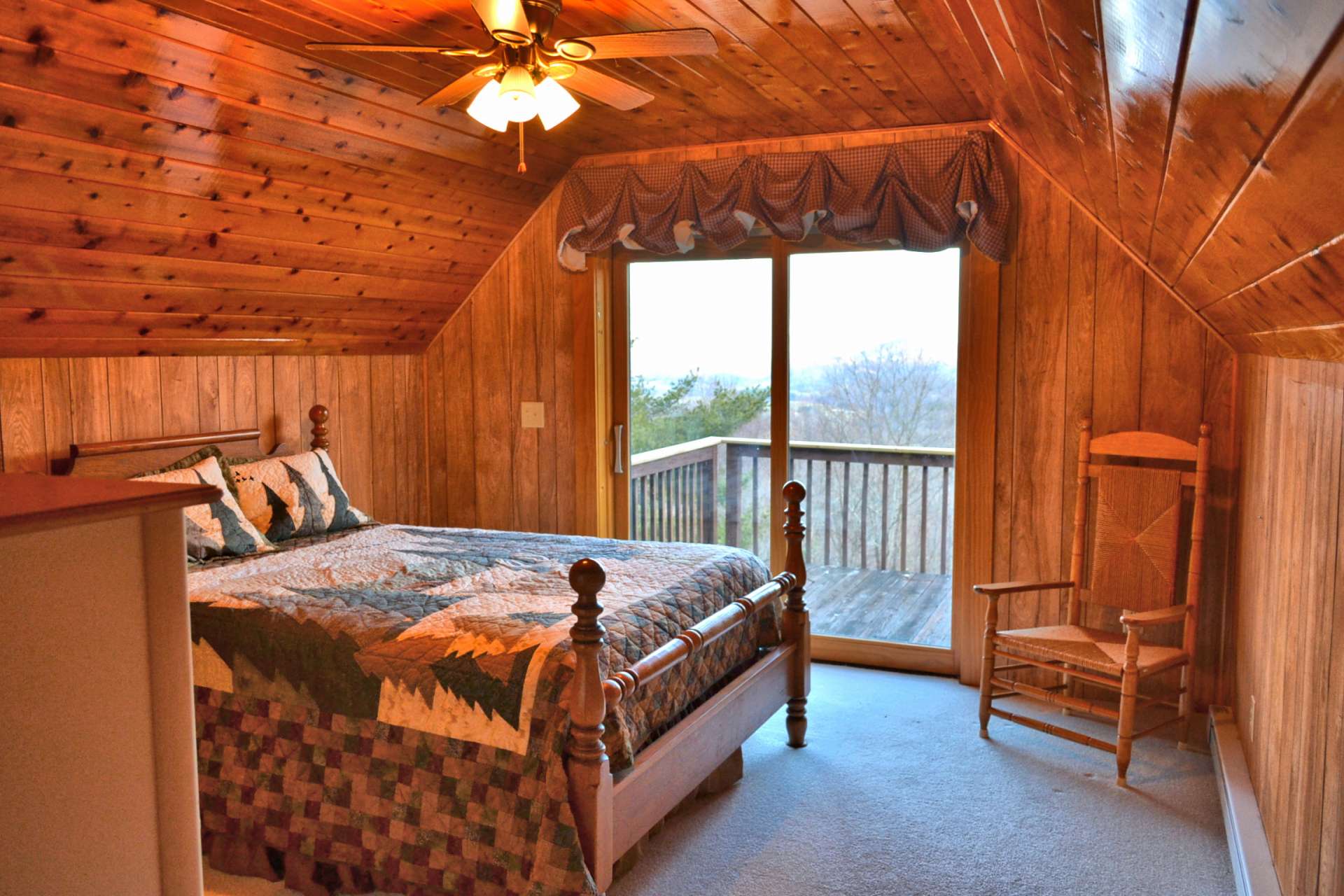 The upper level offers the master suite with private bath and access to a private balcony.