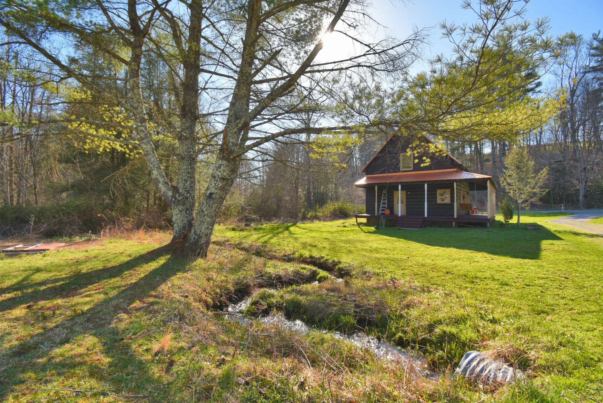 There is a small mountain stream meandering along side the cabin on its way to Whitetop Laurel Creek.