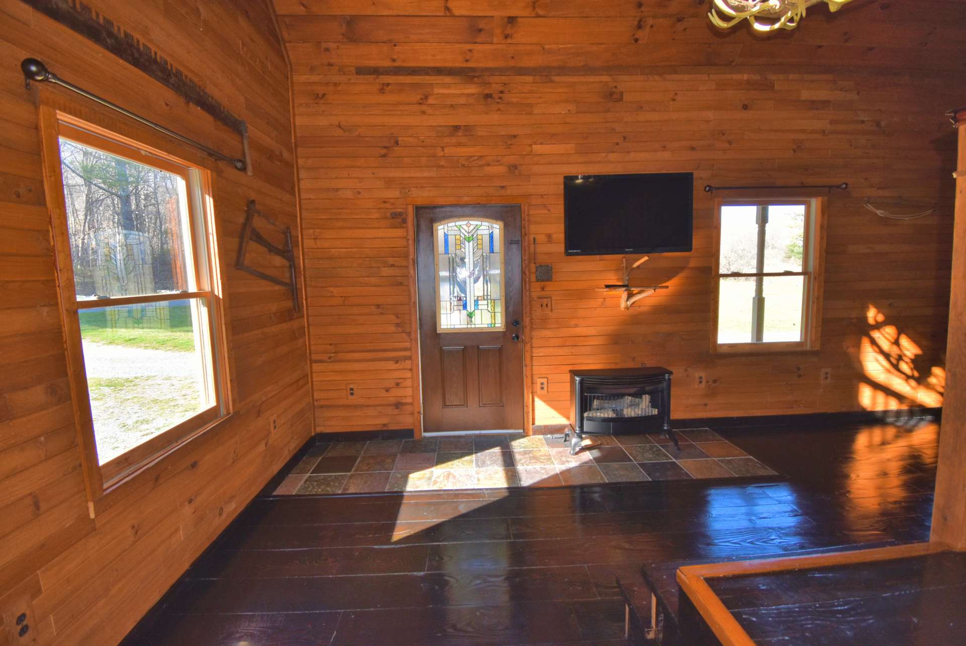 Ceramic tile at the entry. Notice the stained glass in the entry door.