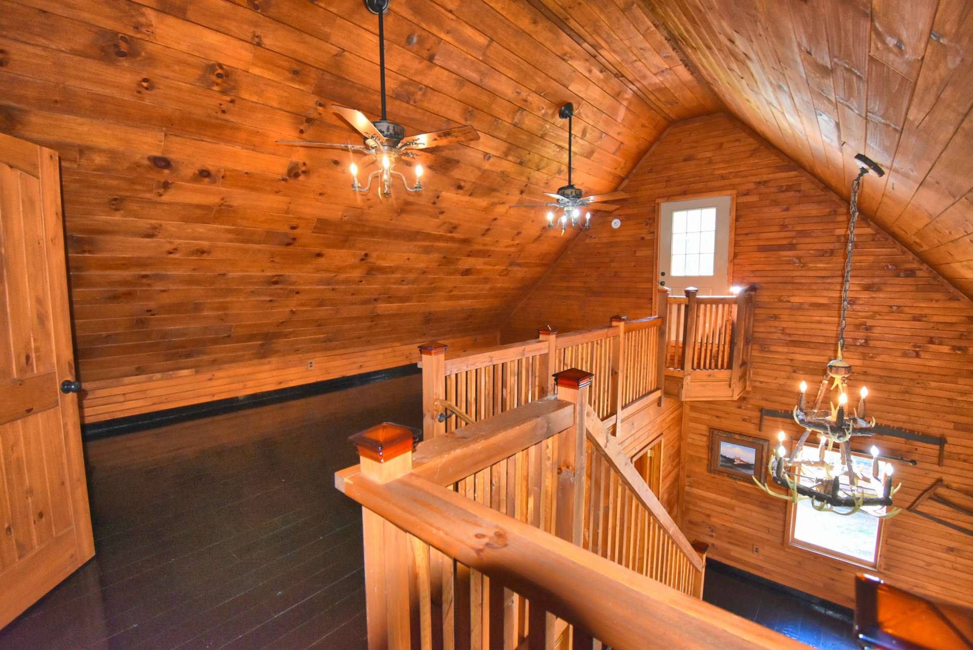 On the upper level, you will find an open loft area overlooking the great room.