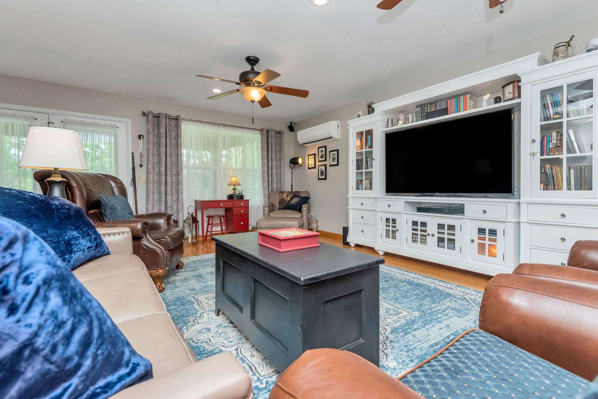 Double doors open to the large covered porch.