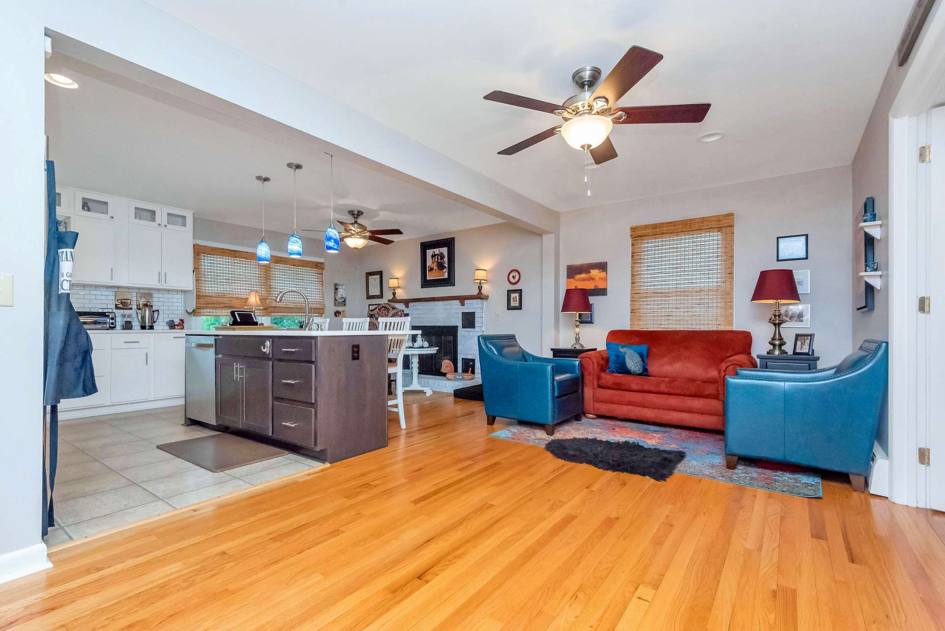 Wood floors in this area and ceramic tile in the kitchen