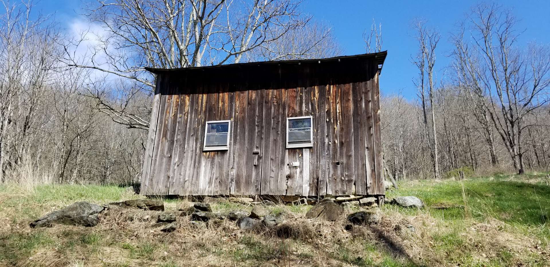 Multiple outbuildings for farm equipment storage.