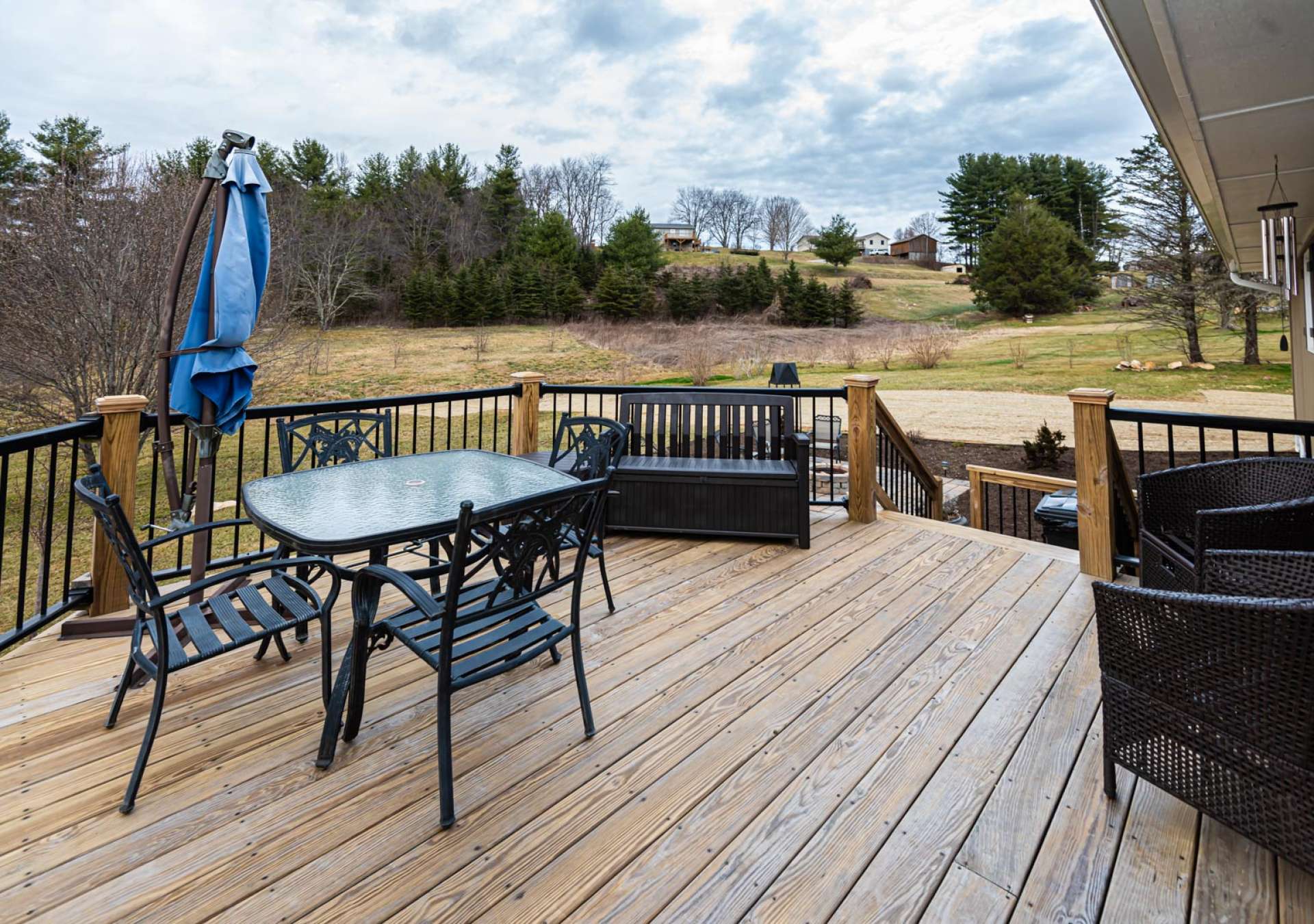 An open back deck offers privacy for outdoor grilling, dining, and entertaining.