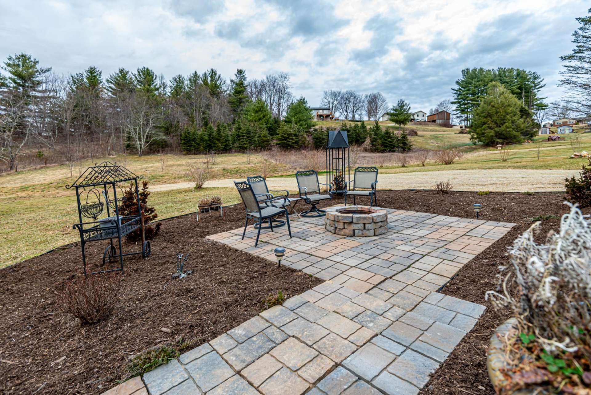 This outdoor entertaining area is perfect for sharing stories and memories around a fire in the firepit while making smores and new memories.