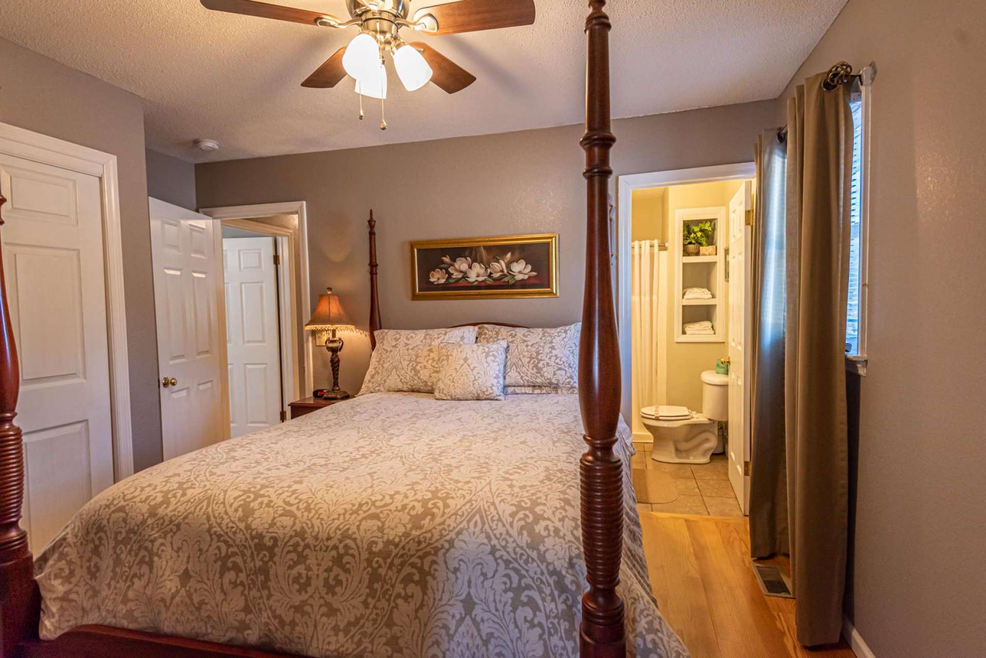 This spacious guest bedroom offers an ensuite bath and walk in closet.